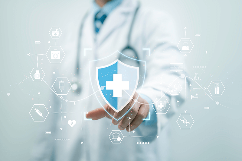 doctor tapping shield with a cross in the middle of it connected to other health related graphics