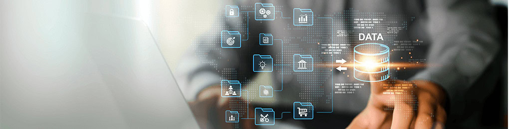 person tapping a database icon next to a laptop