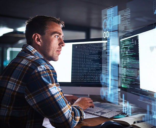 Software Developer Coding Multiple Monitors